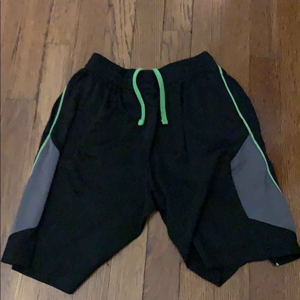 Black, grey and green short shorts for athletics.